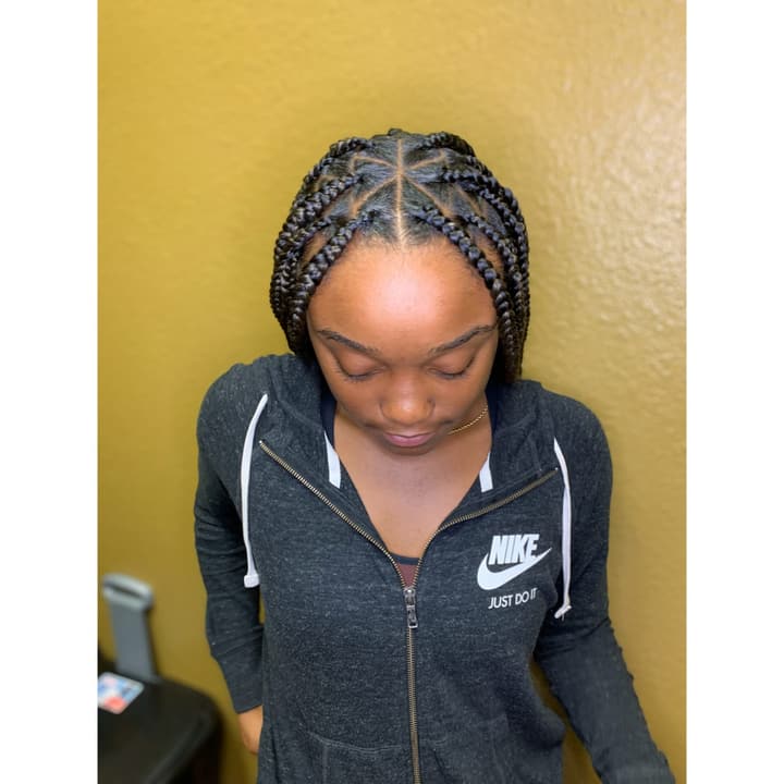 Stitch braids on a young client